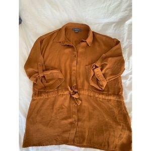 3/4 length rust coloured shirt